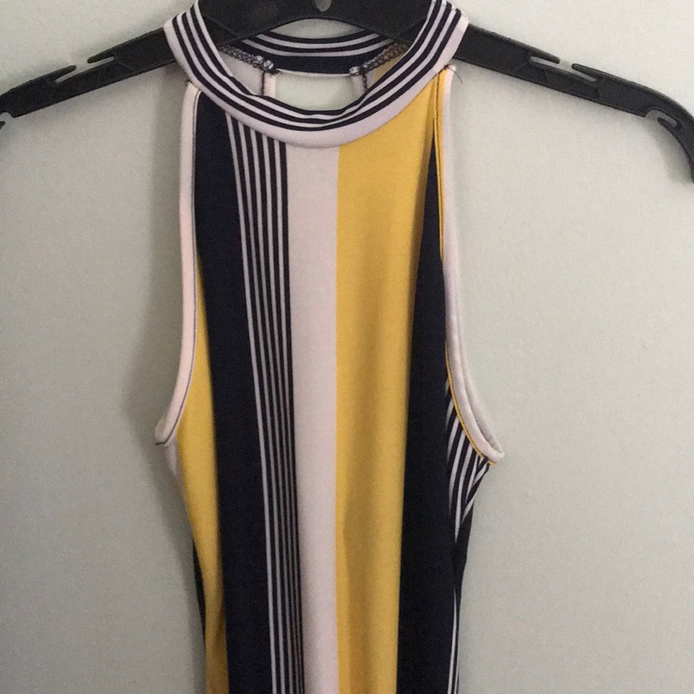 Navy blue, yellow, and white body suit